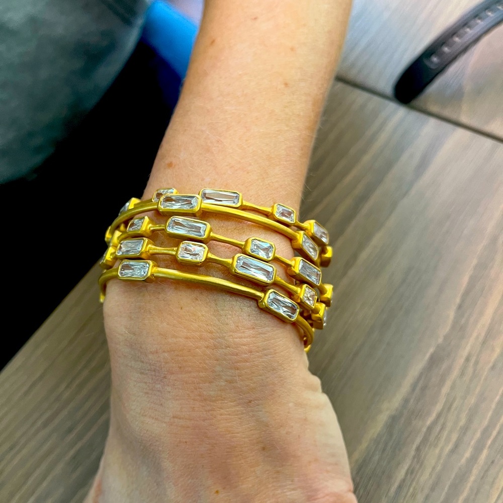 5 Jennifer Miller Bangles. They are a gold color with crystals.